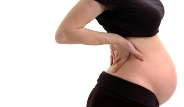 Почему болит спина при беременности 1
