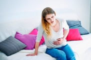 Почему болит желудок при беременности
